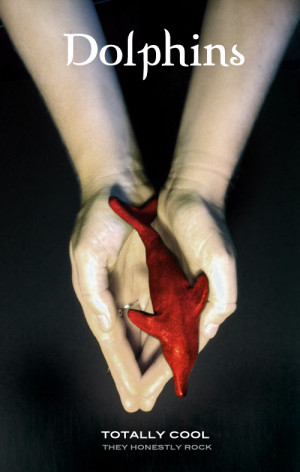 dolphin_twilight Photo of outstretched hands holding a red dolphin.